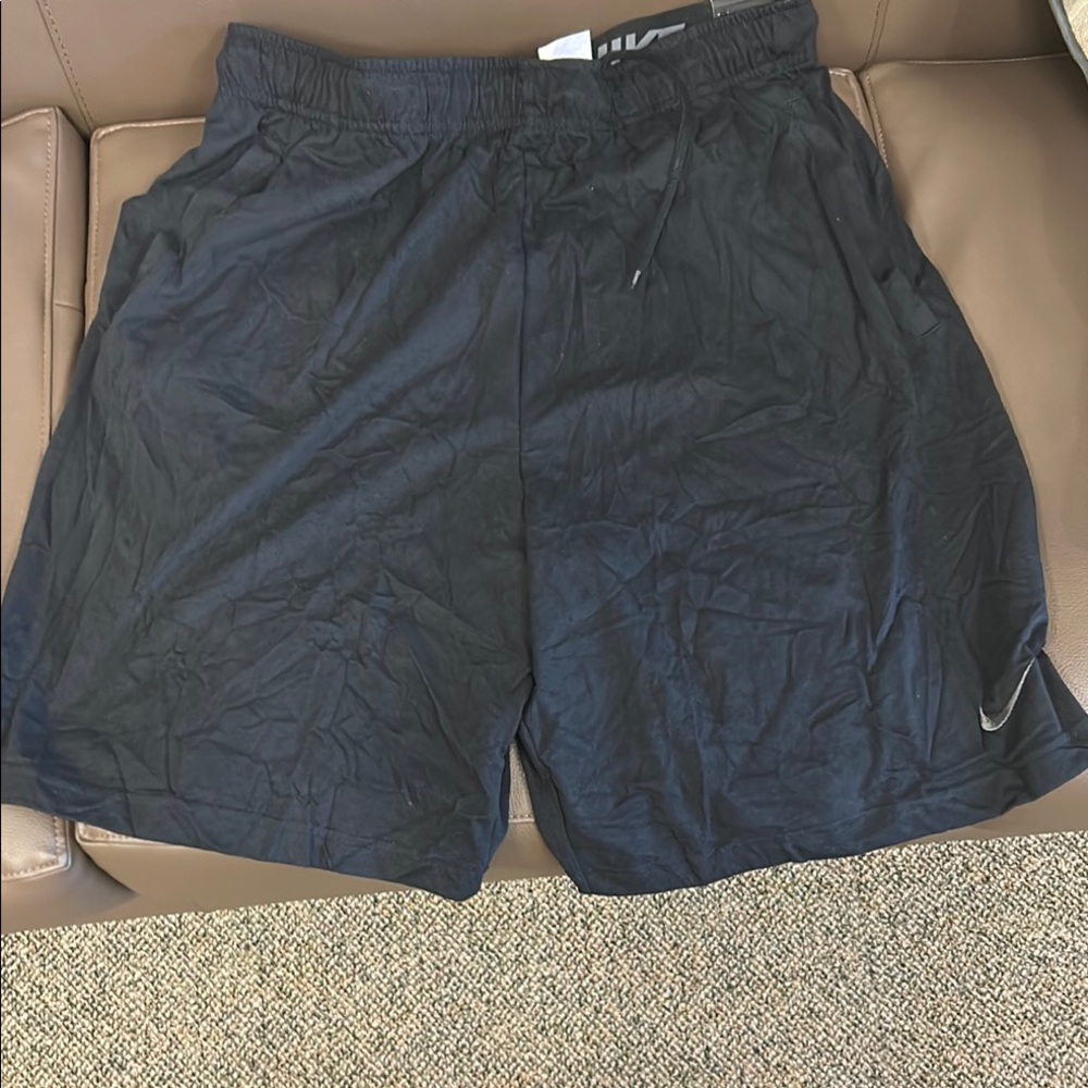 Nike Black Athletic Shorts for Performance. Pockets on sides